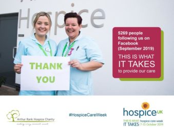 2 nurses holding thank you sign