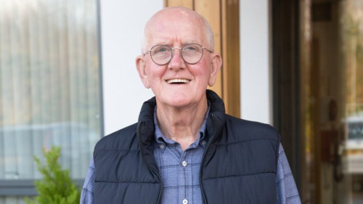 Man with glasses smiling outside Arthur Rank Hospice Charity