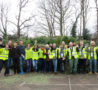 Group in front of collected Christmas Tree