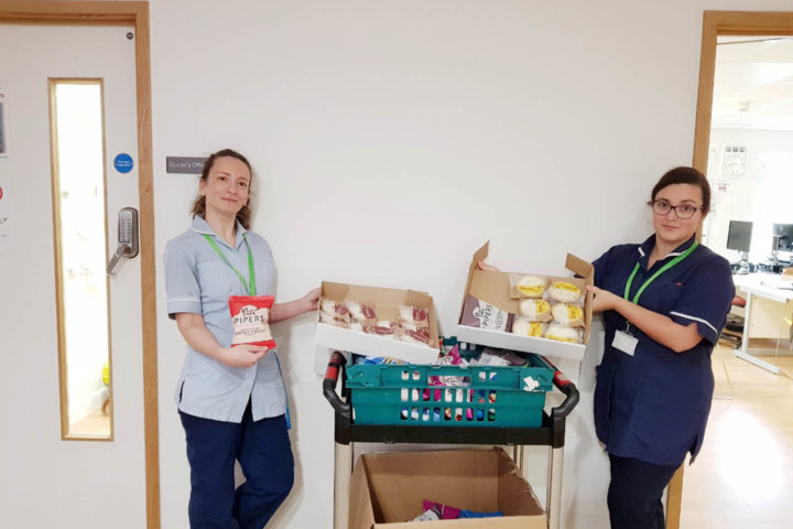 two females showcasing baked goods