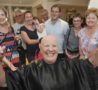Group behind woman who has shaved her head