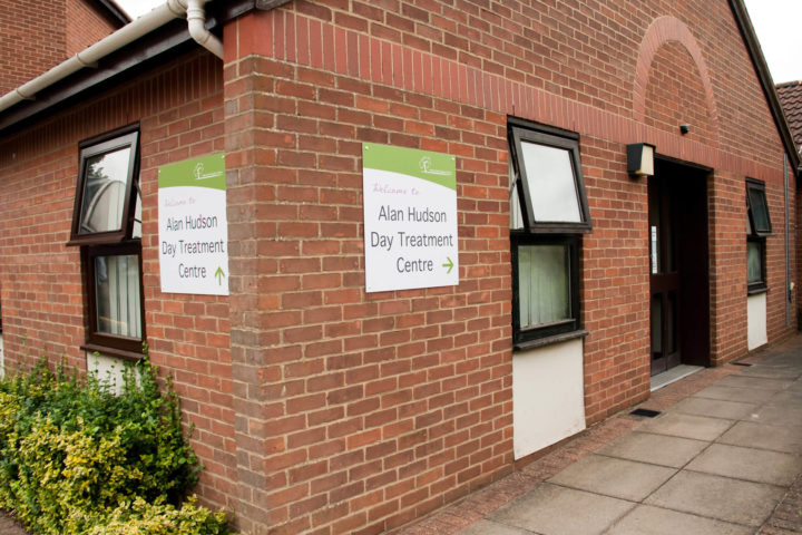 The outside of the building with sign