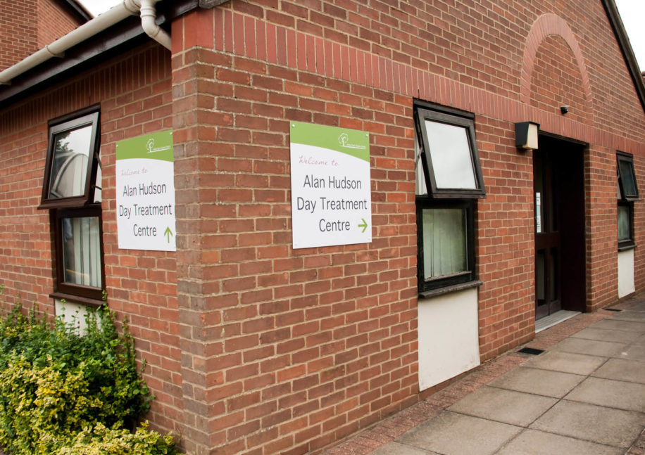 The outside of the building with sign