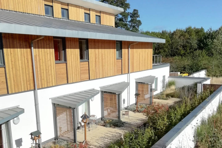 Looking down and left onto enclosed gardens which can be accessed by people living with Dementia