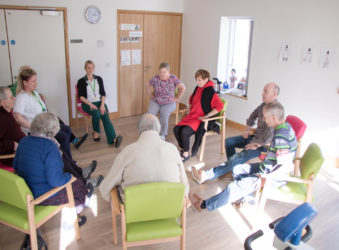A group of patients exercising together in the physiotherapy gym