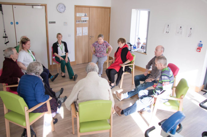 A group of patients exercising together in the physiotherapy gym