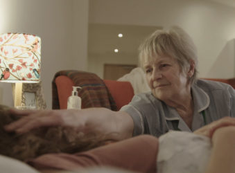 Hospice at Home nurse comforts patient in their own home