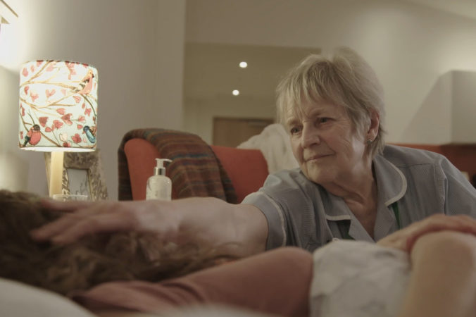 Hospice at Home nurse comforts patient in their own home