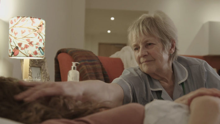 Hospice at Home nurse comforts patient in their own home