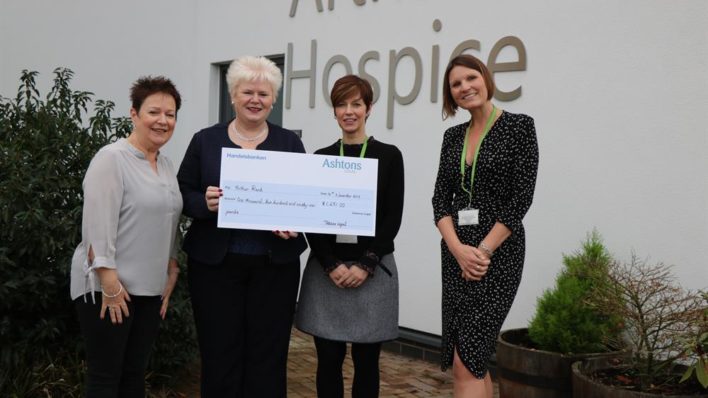 four females holding a big cheque donation