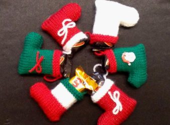 Six Christmassy knitted stockings in a wheel shape