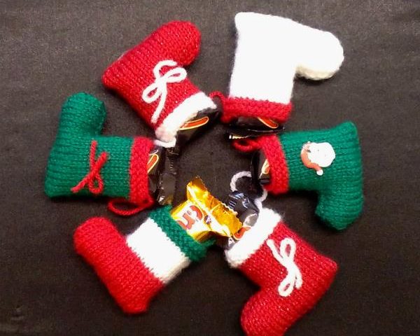 Six Christmassy knitted stockings in a wheel shape