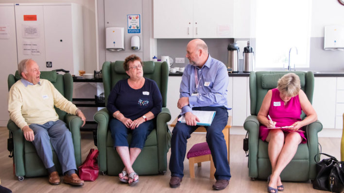 Group of people receiving support in lounge area