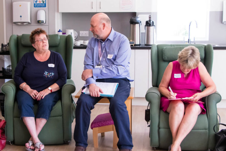 Group of people receiving support in lounge area