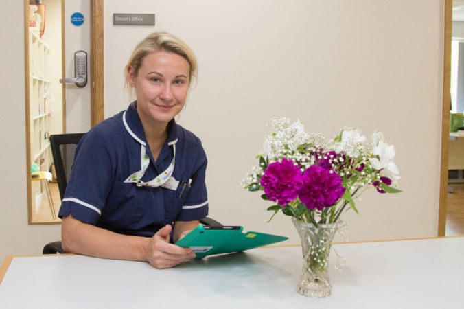 nurse smiling into the camera