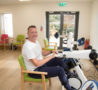Patient sat at Medimotion Bike in physiotherapy gym