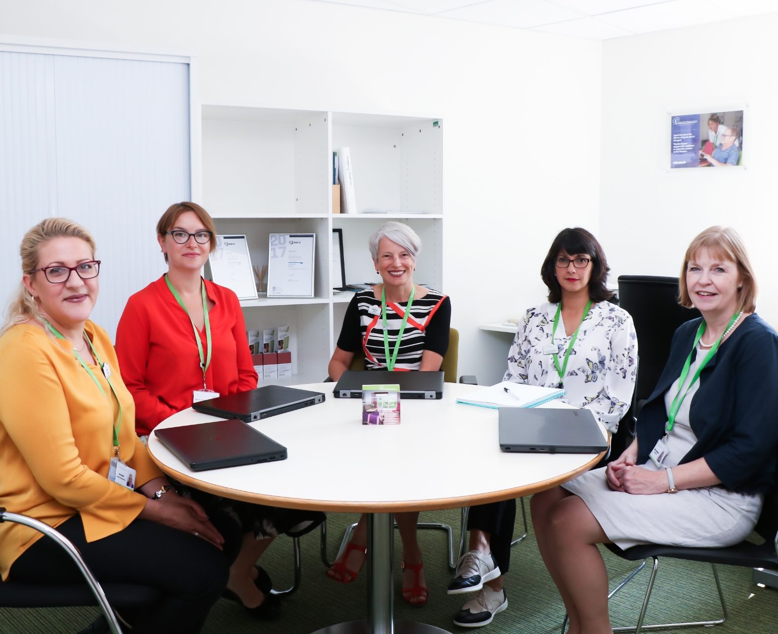 Some of the Senior Leadership Team meeting in CEO Sharon Allen's Office