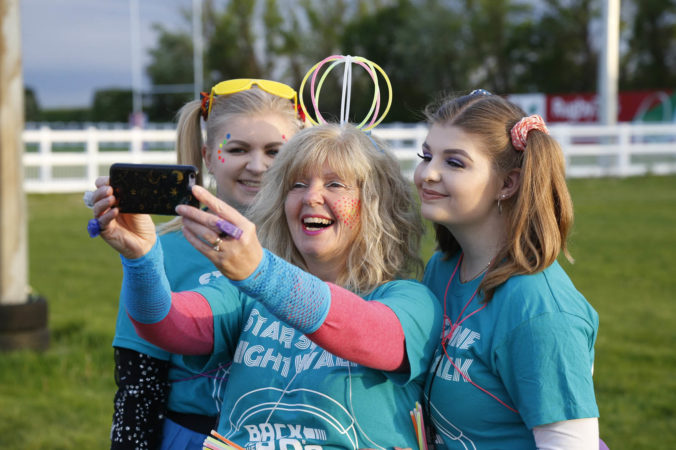 Group in brightly coloured facncy dress at Star Shine Walk