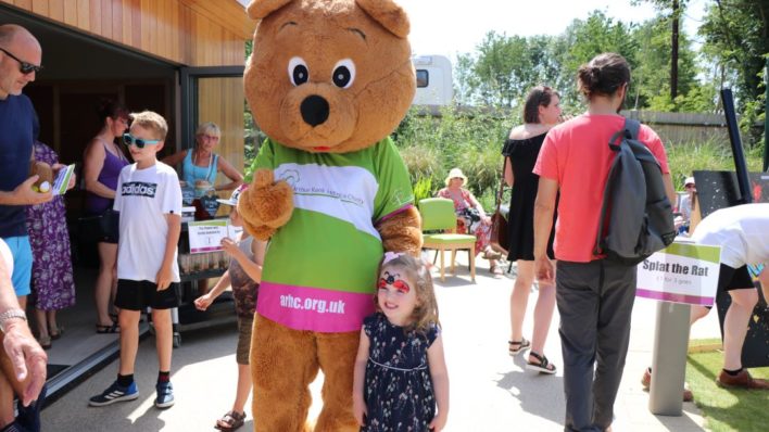 Life sized bear outside with child