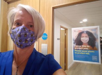 CEO, Sharon Allen, wearing a face covering