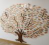 The Memory Tree with gold, silver and bronze coloured leaves engraved with a loved one's name