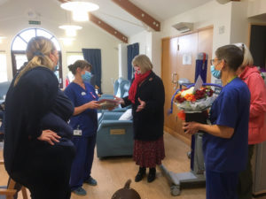 Colleagues at the Alan Hudson Day Treatment Centre organised a socially distanced goodbye for volunteer Chris and presented her with a cake and flowers to thank her for her valuable contribution. 