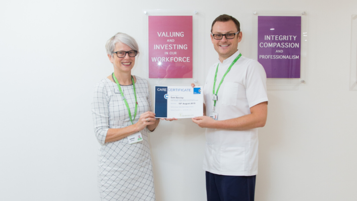 CEO from Arthur Rank Hospice Charity and Health Assistant Sam at Arthur Rank Hospice with his Skills For Care Certificate