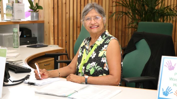 Volunteer Tina Shah in her role as volunteer Receptionist at the Arthur Rank Hospice