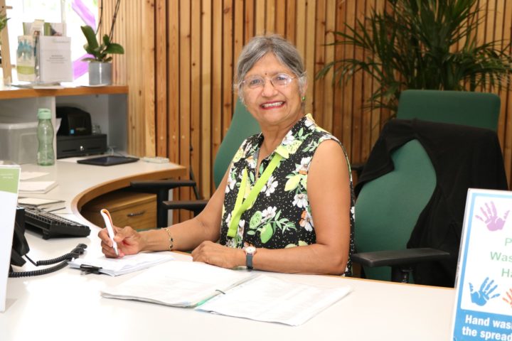 Volunteer Tina Shah in her role as volunteer Receptionist at the Arthur Rank Hospice