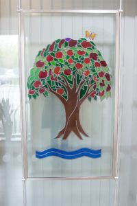 Arthur Rank Hospice Royal stained glass window displayed in Evelyn Day Therapy Window