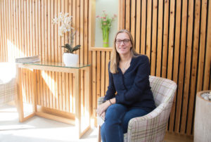 Wendy in the Sanctuary at the Hospice with light flooding in from window to left