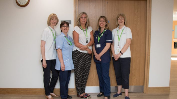 Five members of the Lymphoedema team standing together in the Bradbury Wellness Centre, before the pandemic began