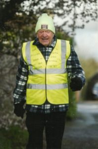 George Ginn walking in his high vis vest for Step A Million