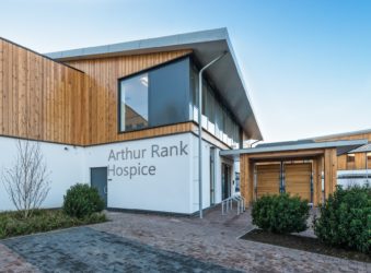 The front of Arthur Rank Hospice Charity’s home at Shelford Bottom: the Education and Conference Centre is based in the rooms with large windows above the entrance.