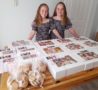 Two young sisters selling cookies to raise month