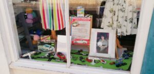 Miniature Porsches sold at Arthur Rank Hospice Charity shop in Regent Street, Cambridge to highlight Stephen Hughes’s challenge to Norway in a Porsche 944. 