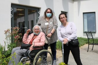 Faith (centre) with patients of the Living Well Services