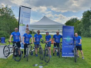 Lee and his friends dressed in blue t-shirts with their cycles fundraising for MND. 