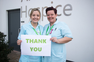 Clinical Staff at Arthur Rank Hospice holding a Thank you sign