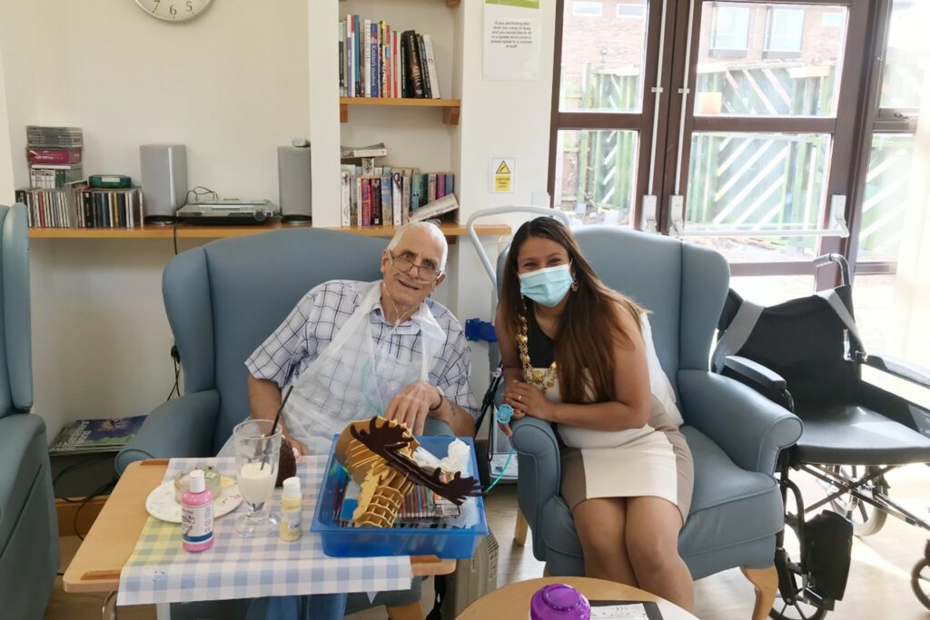 The Mayor's wife and male patient sitting on chairs in the Living well Service at the Alan Hudson Day Treatment Centre in Wisbech 