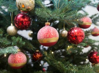 Red baubles on a green Christmas tree