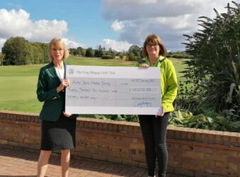 Ros and Alison holding cheque at Gog Magog golf cheque presentation