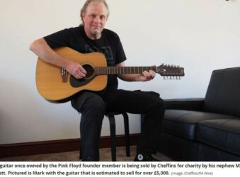 Mark Barrett holding Syd Barrett's guitar Image Cheffins PA Wire
