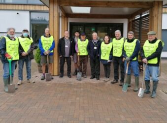 Group from Rotary Club of Cambridge Rutherford standing outside Arthur Rank Hospice