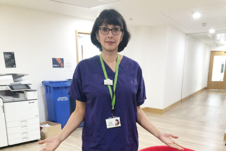 Dr Petersen with scrubs donated during the Pandemic