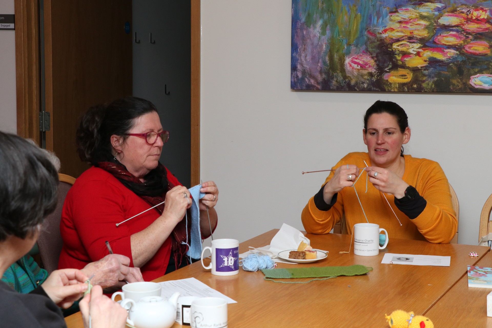 2 females knitting 