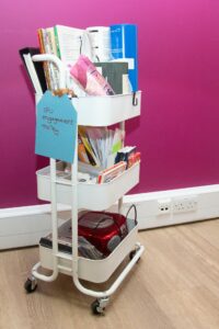 White trolley with activities and a blue sign with IPU engagement trolley on it 