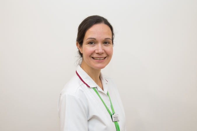Occupational Therapist Marianna in her uniform, smiling
