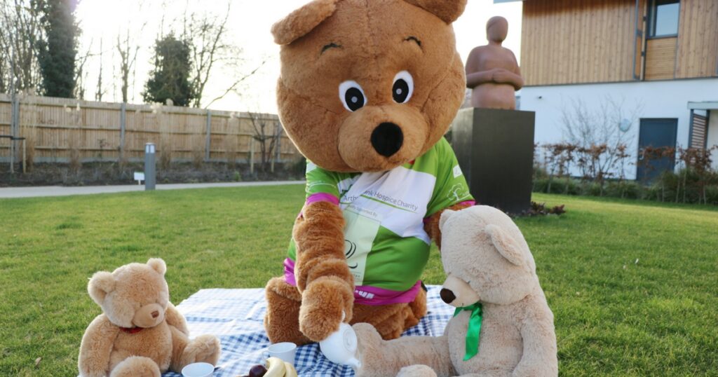 Life sized bear in the garden with a picnic