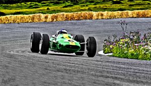 A green racing car on a track